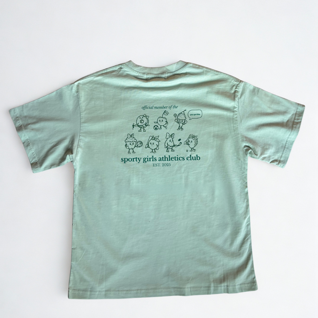 Light green t-shirt with graphic design and text on a white background